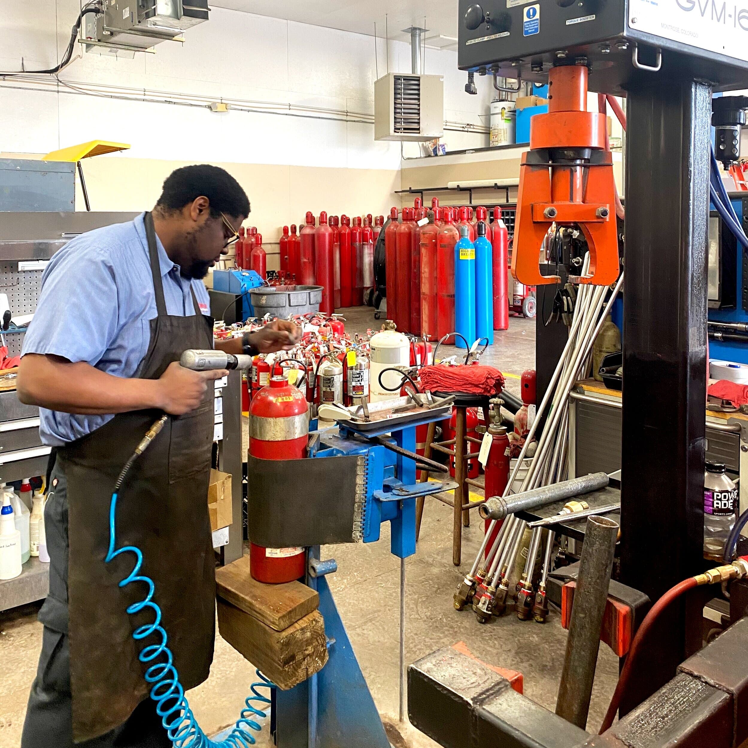 First-Line technician hydro-testing a cylinder in the Paducah shop